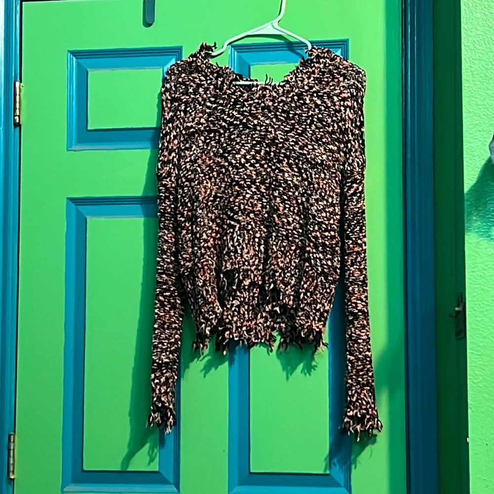 “Torn” sweater sized medium only wore a couple of times no holes.